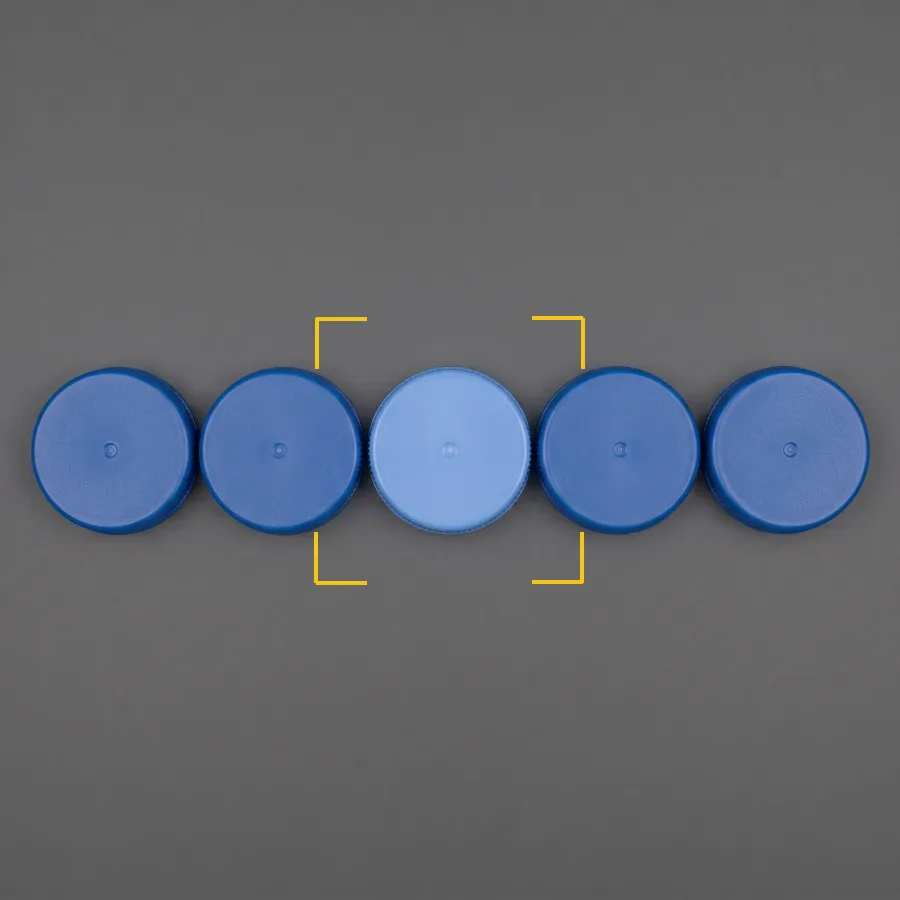 One cap a different shade. Colour and shade discrimination.