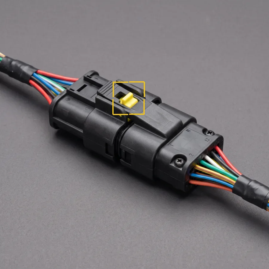 Half inserted, latch open. Connector seating and pin check.