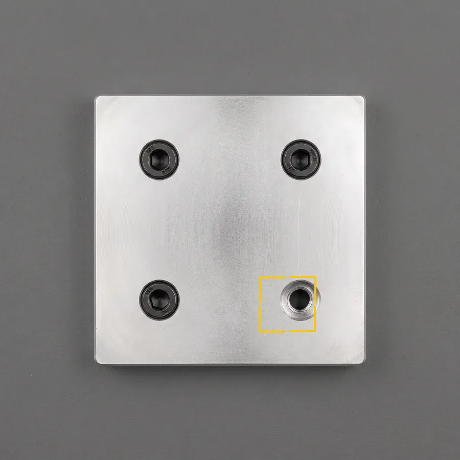 Missing screw, hole empty. Fastener presence verification.